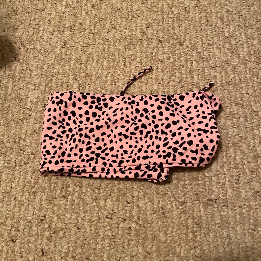 pink bathing suit top w/ a black cheetah print